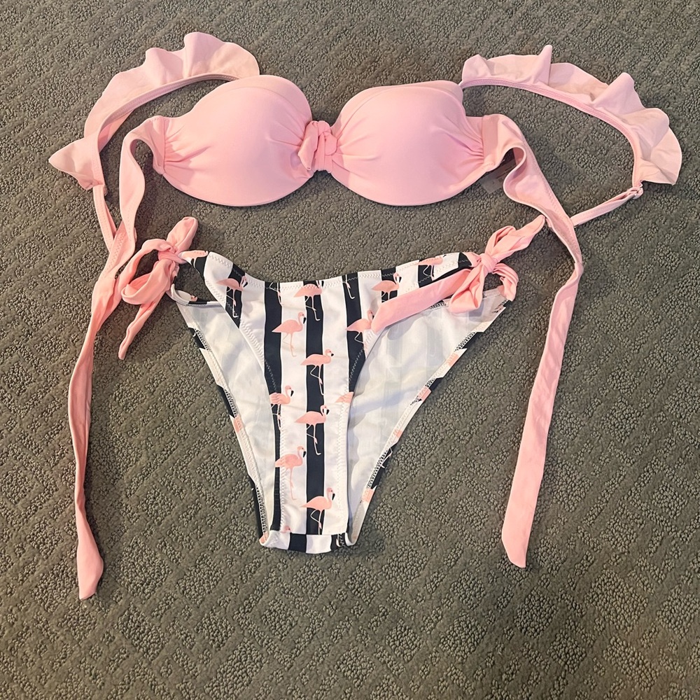 Adorable pink top with black and white striped bottoms with pink flamingos